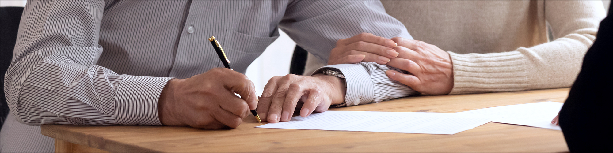 Couple Signing a Document